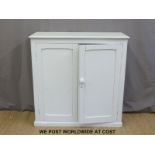 A two door painted pine cupboard (W106 x D40 x H107cm)