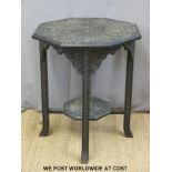 A carved octagonal Anglo Indian ebonised table (D61 x H72cm)