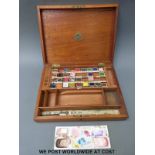 A vintage wooden watercolour box The Students' Box of 'Landseer' watercolours with ceramic mixing