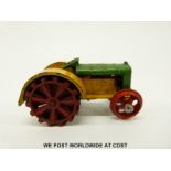 Dinky Toys diecast model Fordson N tractor with green and yellow body and red wheels