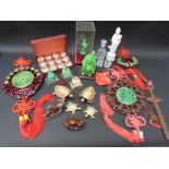 A quantity of Oriental buddha figures, carved horses, jade style plaques,