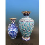 An Indian Sind pottery vase c1900, 46cm tall together with a similar example.