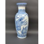 A Chinese blue and white floor vase decorated with peacocks and flowers,