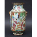 A 19thC Chinese famille rose vase decorated with court scenes and blue Dogs of Fo with gilt