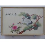 A Chinese embroidery on silk of birds on a branch with script top left,