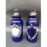 A pair of blue glass apothecary jars,