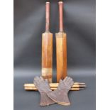 Two vintage cricket bats,