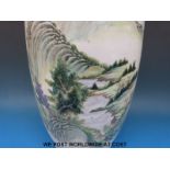 A large Chinese Ching Dynasty vase with Foo Dog handles and landscape decoration,