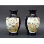 A pair of Japanese Satsuma vases with gilt decoration on dark blue ground, 19cm tall.