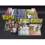 A large collection of cricket related programmes and books
