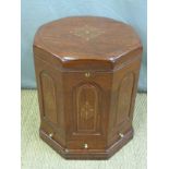 A brass inlaid octagonal drinks cabinet with hinged lid, lift out tray and three drawers,