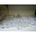 A large collection of glass including some sets of cut glass.