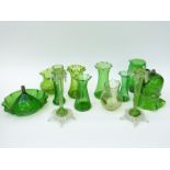 Eleven pieces of green glassware including Loetz style vases, enamelled jug,