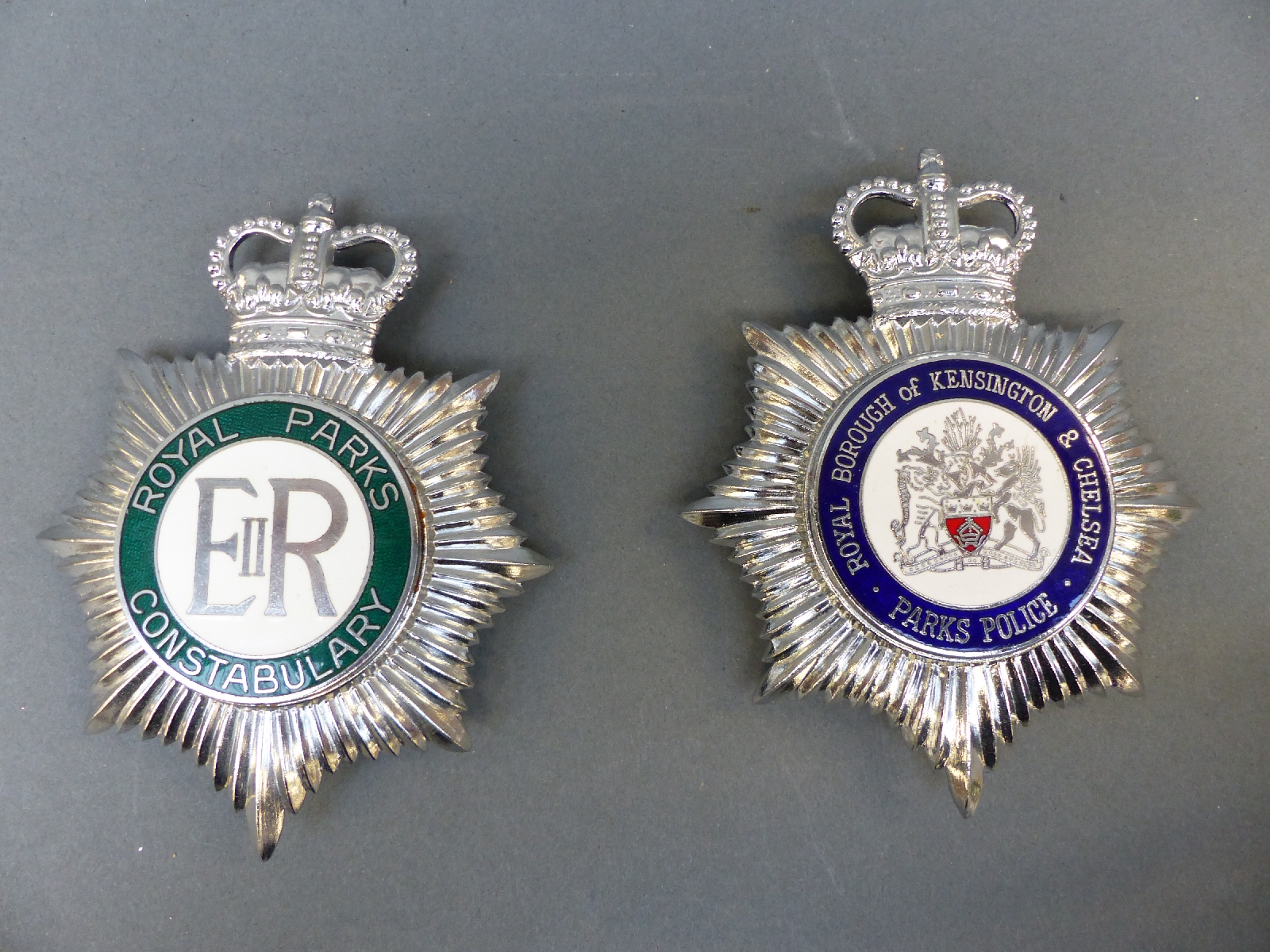 Two enamel police helmet badges comprising Royal Borough of Kensington and Chelsea Parks Police and