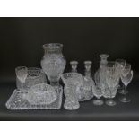 A collection of Waterford and Edinburgh Crystal and similar cut clear glassware including vases,