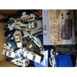 A collection of boxed and loose diecast toys, most police themed,