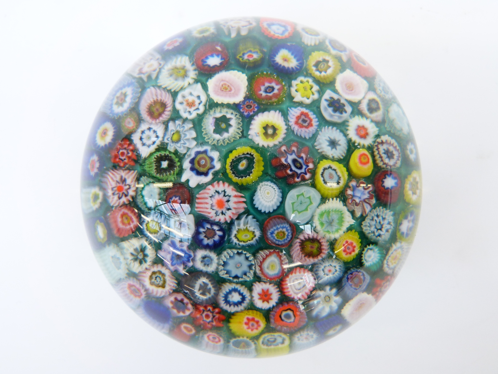 A millefiori glass paperweight with various multicoloured canes on a turquoise ground, - Image 2 of 3