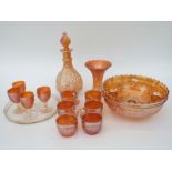 A collection of Carnival glass including a punch bowl