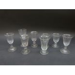 Eight 19thC wine glasses all with cut decoration and knopped stems, largest 12.