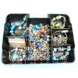 A collection of silver Pandora style beads