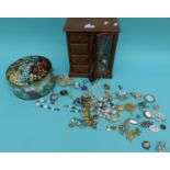 A collection of costume jewellery to include brooches, silver bracelets, beads, earrings, locket,