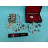 A collection of costume jewellery including three silver lockets,