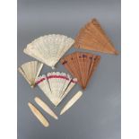 Five 19thC/early 20thC ivory and other fans, some with fine fretwork decoration,