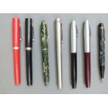 Five Shaeffer and two Conway Stewart fountain pens and propelling pencils including White Dot,