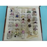 Over 40 silver rings set with various gemstones and filigree rings etc