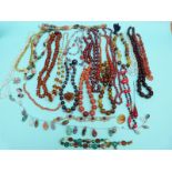 A collection of beaded necklaces to include early glass beads, amethyst necklace,