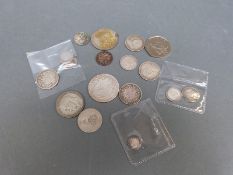 A quantity of Victorian silver coinage to include various shillings including bun head 1898