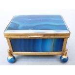 A blue banded agate and gilt metal mounted box raised on four ball feet,