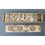 A Napoleonic prisoner of war carved bone domino set in case with sliding lid,