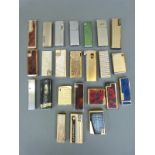 A collection of approximately 20 cigarette lighters to include Superkings,