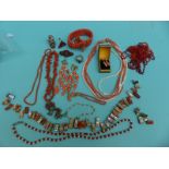 A pair of coral earrings, coral necklaces, silver ring in the form of a dragon set with coral,