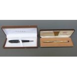 Two boxed Cross pens,