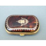 A tortoiseshell purse inlaid with gold piquot design,