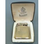 A 9ct gold mounted Ronson lighter in case