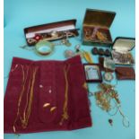 A collection of costume jewellery to include silver chain, Ronson lighter, brooches,