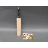 A miniature cricket bat signed by four England international players including Jack Russell