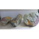 Three large hardstone boulders,