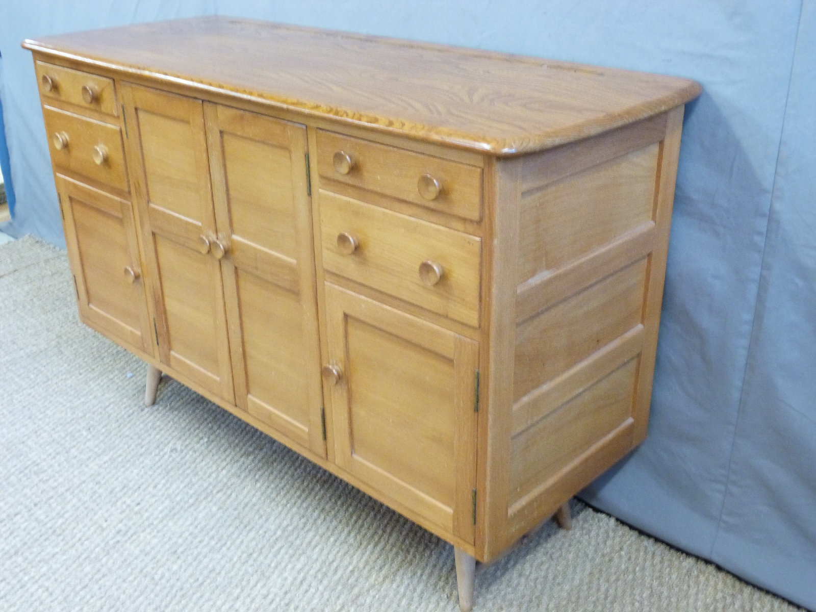 A retro Ercol light elm sideboard with an arrangement of four cupboard doors and four drawers inc - Image 2 of 2