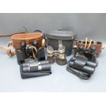 A cased pair of Wray of London 10x35mm "Defiant" binoculars,