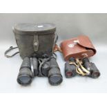 A cased pair of Carl Zeiss Jenoptem 8 x 30 binoculars and a cased pair of Regent 10 x 50 binoculars