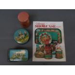 Two vintage Tindeco Harrison Cady decorated Peter Rabbit metal candy tins, one circular,