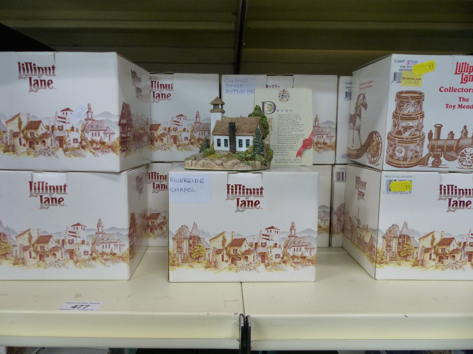 Eighteen white boxed Lilliput Lane cottages to include The Toy Mender's (Collectors' Club),