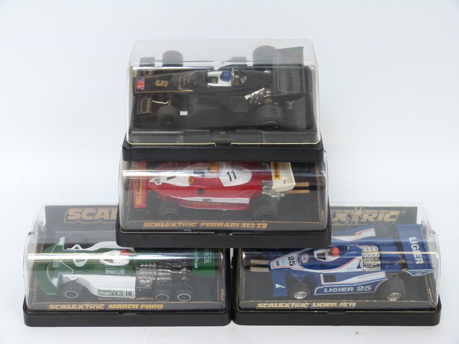 Four Scalextric model Formula 1 cars March Ford C131, Ferrari 312T3 C136,