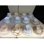 A collection of decorative and collectable trios / cups and saucers including Coalport,