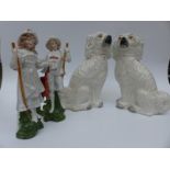 A pair of Staffordshire dogs and two figures
