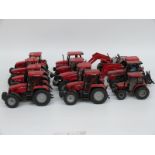 Twelve Britains and similar 1:32 scale diecast and plastic model Case tractors,